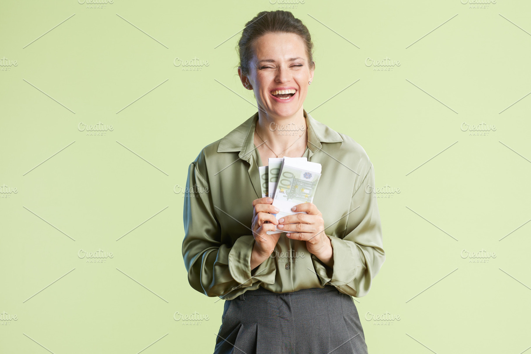Joyful woman celebrating financial success, a Person Photo by Alliance Images