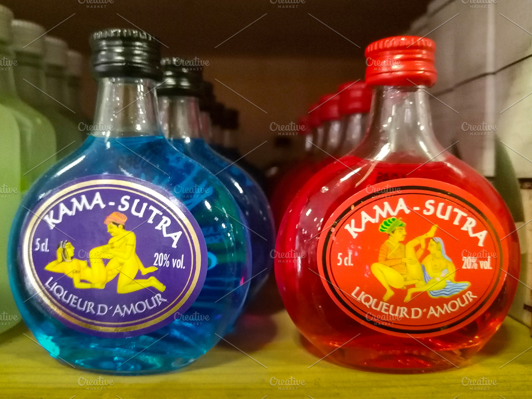 Colorful liqueur bottles on wooden shelf, a Food & Drink Photo by DanFLCreativo