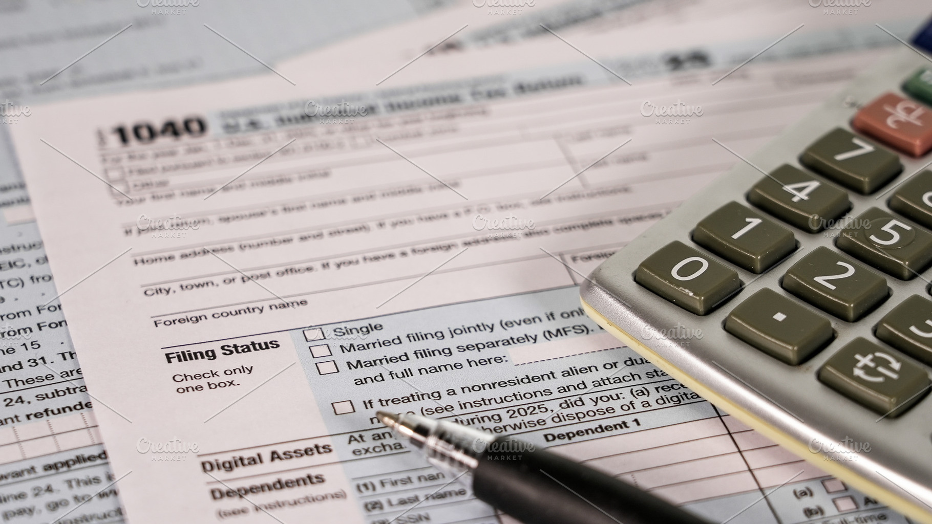 Tax form and calculator on table wit, a Business Photo by 1miromiro
