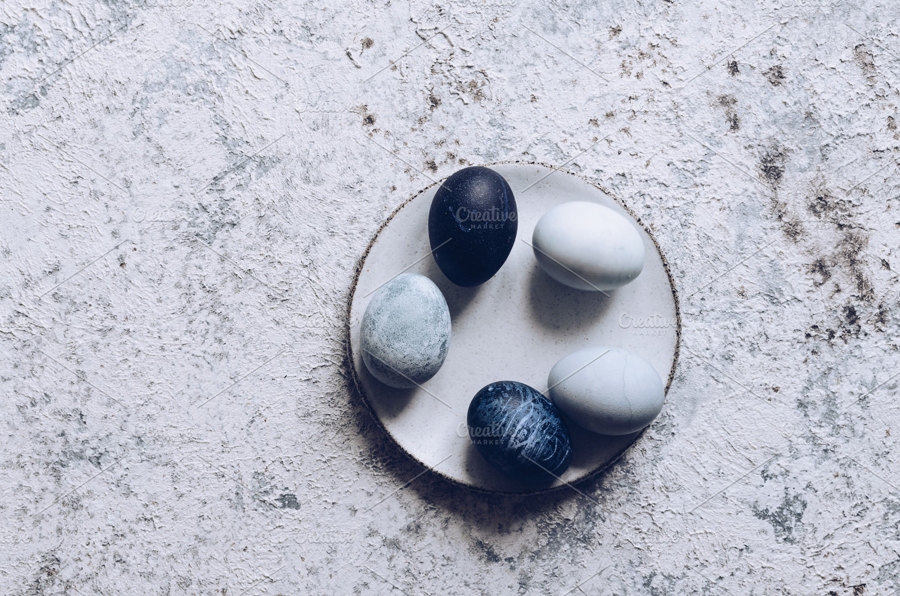 Easter eggs with marble stone effect containing easter, egg, and color, a Food & Drink Photo by NelliKovalchuk