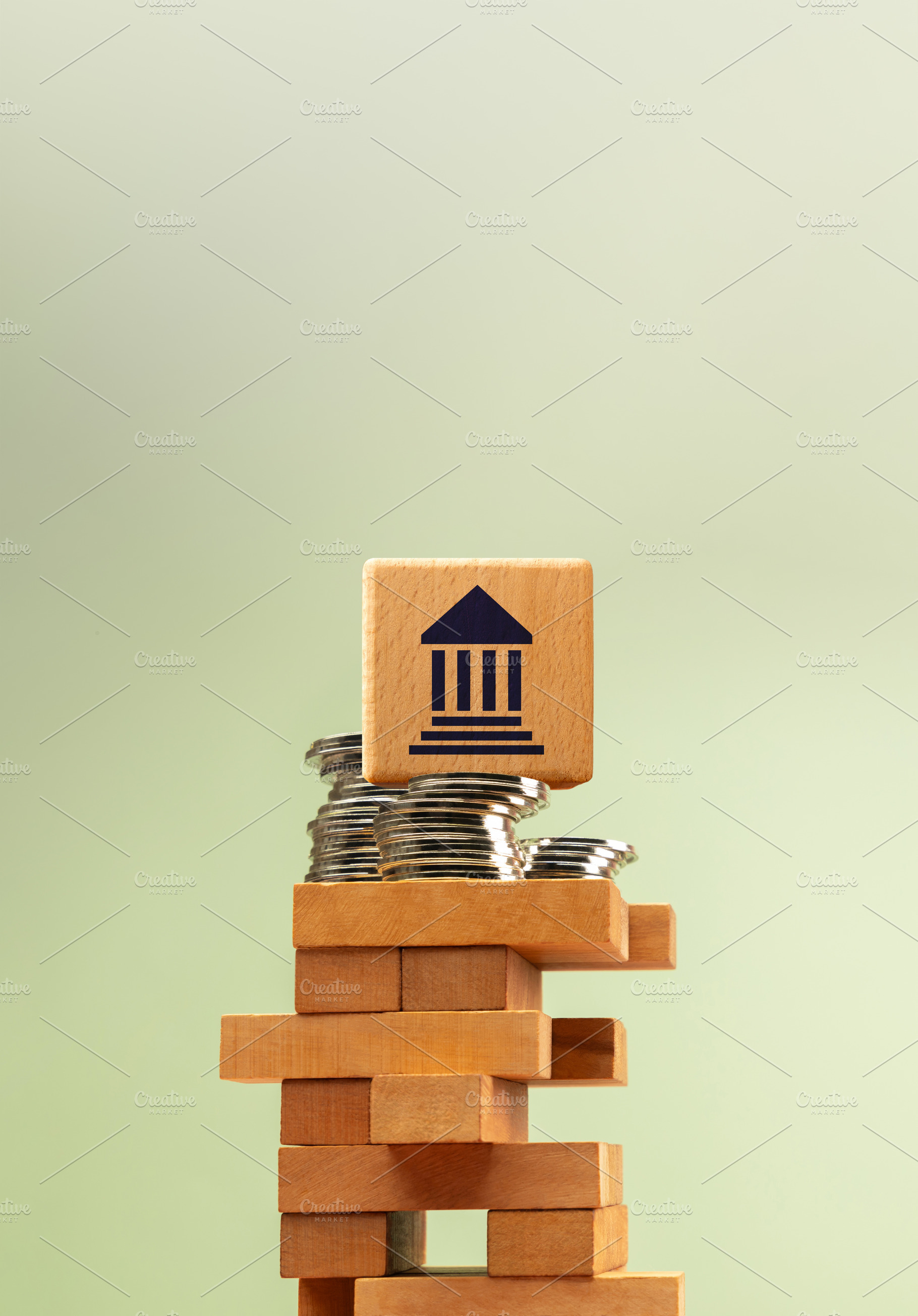 Wooden government bank symbol stacked on unstable blocks with co, a Photo by salmon.black