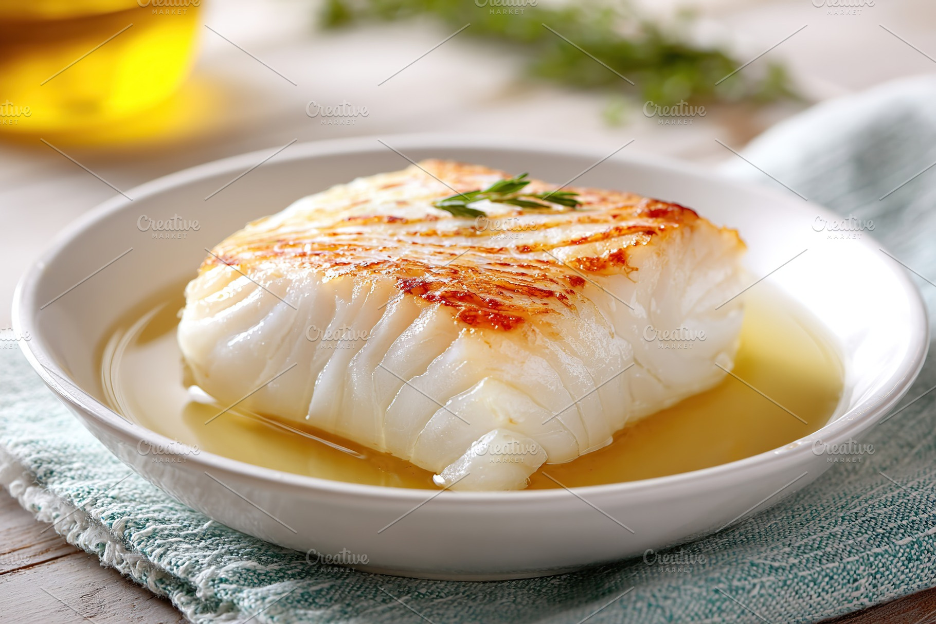 Grilled fish fillet served with aromatic broth and herbs for a flavorful meal, a Food & Drink Photo by AlyaAnd