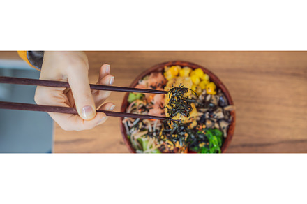 Woman eating Raw Organic Poke Bowl, a Food & Drink Photo by Elizaveta Galitskaya