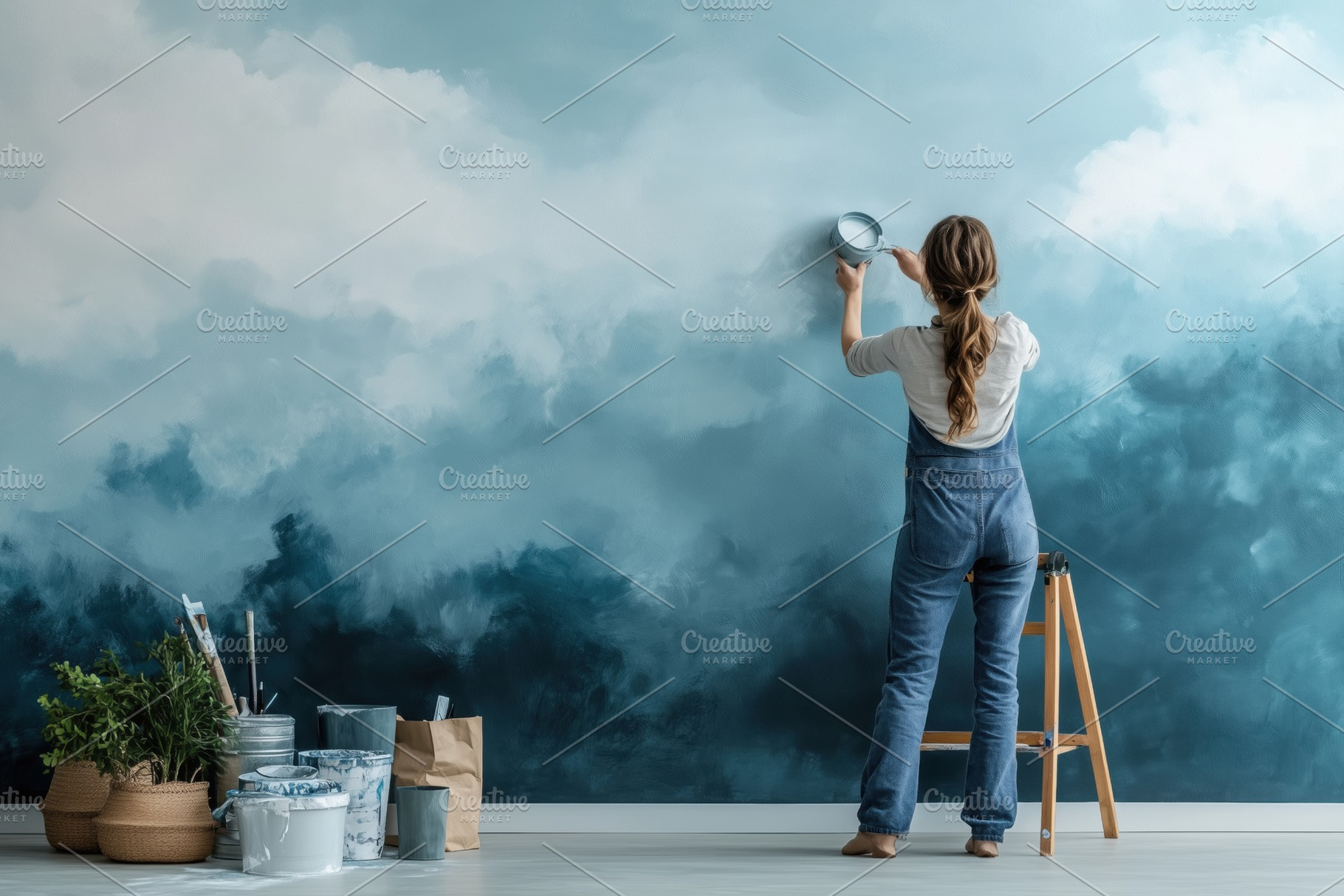 A woman person decorating room in overalls paints a cloud mural on a wall, surr, a Person Photo by Textures & Backgrounds