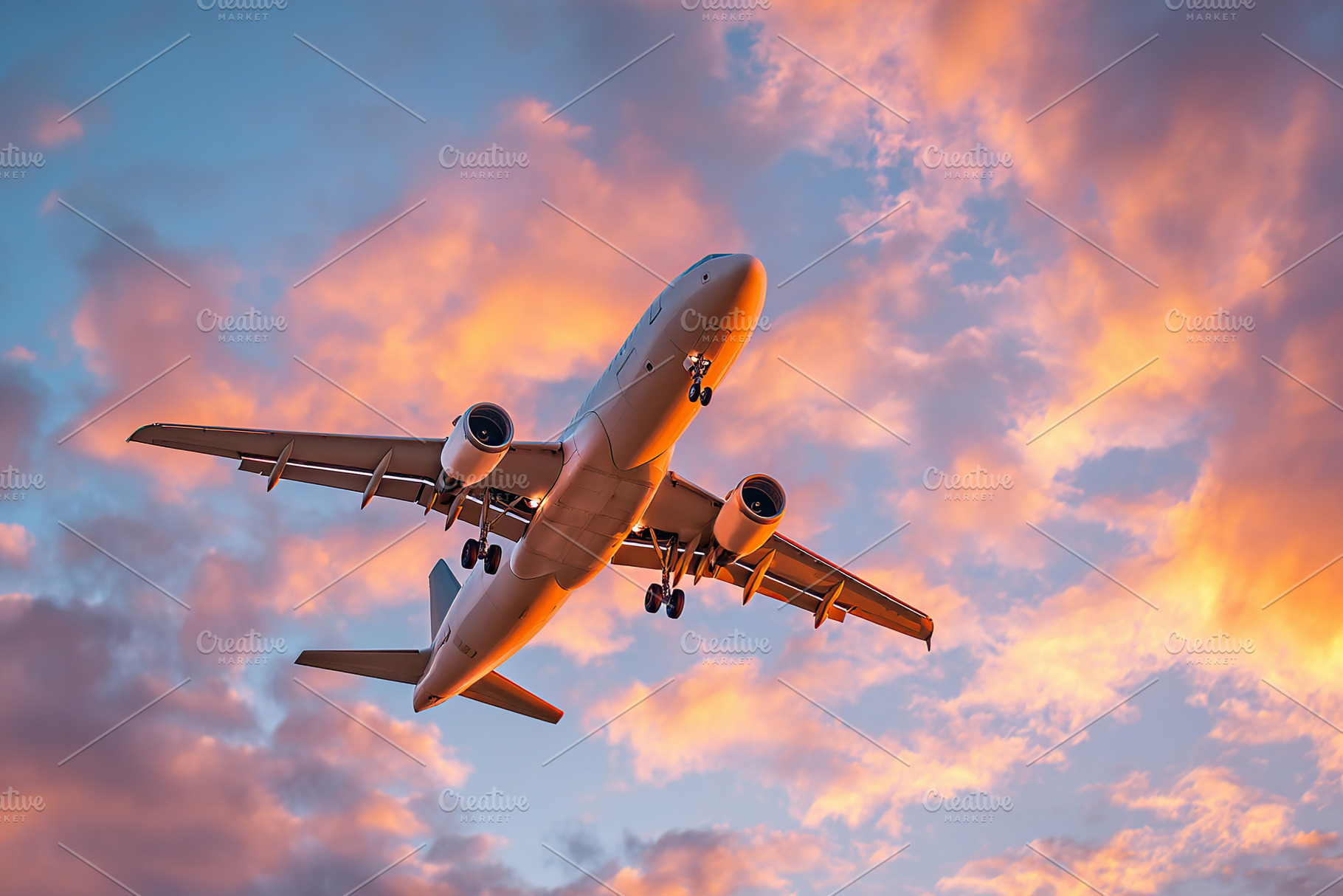 Plane soars gracefully through the colorful sky at sunset, a Transportation Photo by AlyaAnd