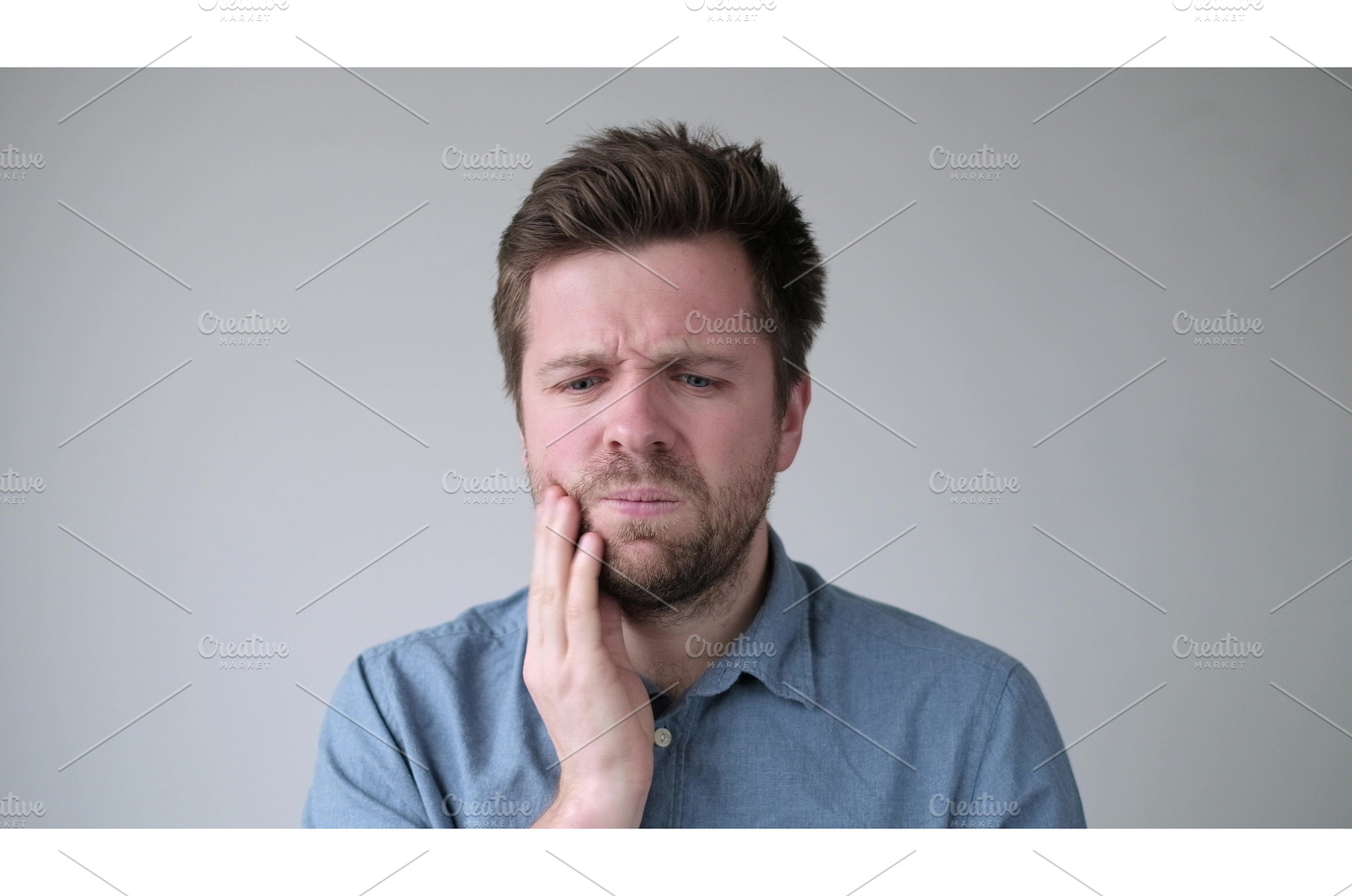Caucasian man suffering tooth pain, a Health & Medical Photo by Koldunova