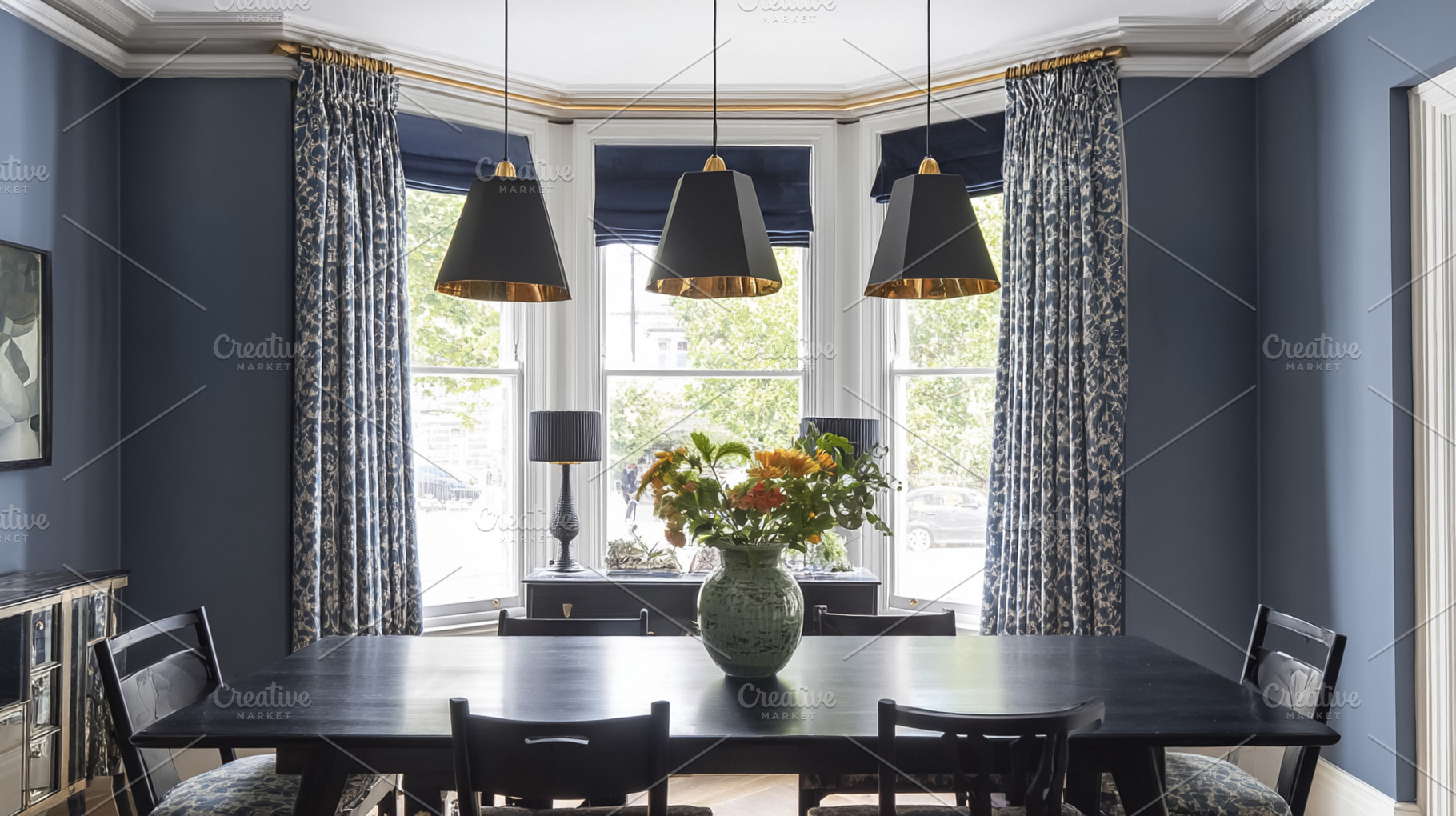 Contemporary dining room with blue walls, black table, pendant l, a Photo by Studio ANNA