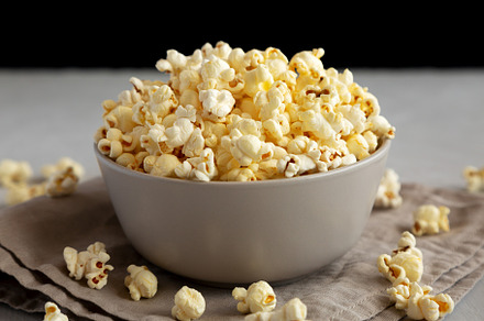Homemade Salty Popcorn in a Bowl, side view., a Food & Drink Photo by LiudmylaChuhunova