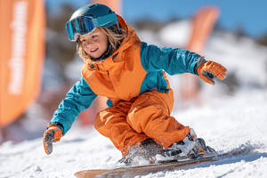 Young child skiing on snowy slope, a Sports & Recreation Photo by AlyaAnd