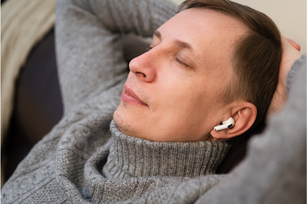 man relaxing on cozy couch, a Holiday Photo by piter.goskov