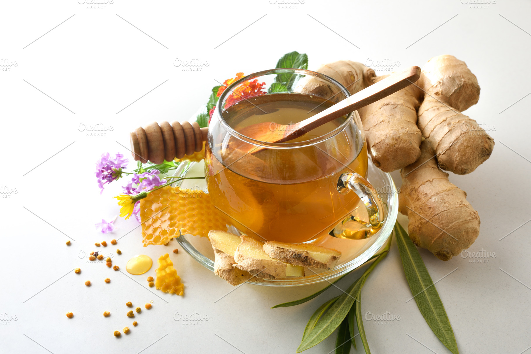 Ginger and honey infusion with products on white elevated view, a Food & Drink Photo by Davizro's Market