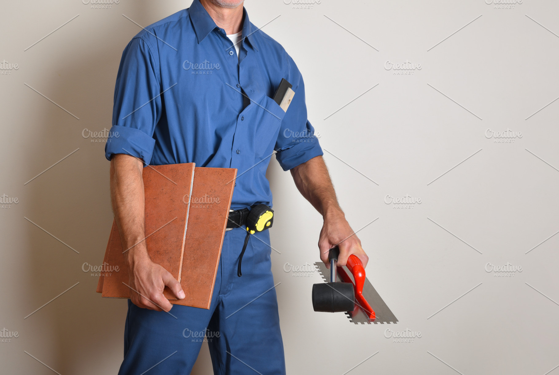 Tiler with work clothes and work tools, a Person Photo by Davizro's Market