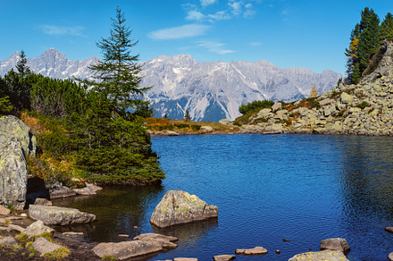 Calm autumn Alps mountain lake with clear transparent water and, a Nature Photo by YuriyB