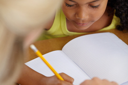 Helping her get to the answer, a Photo by Peopleimages.com