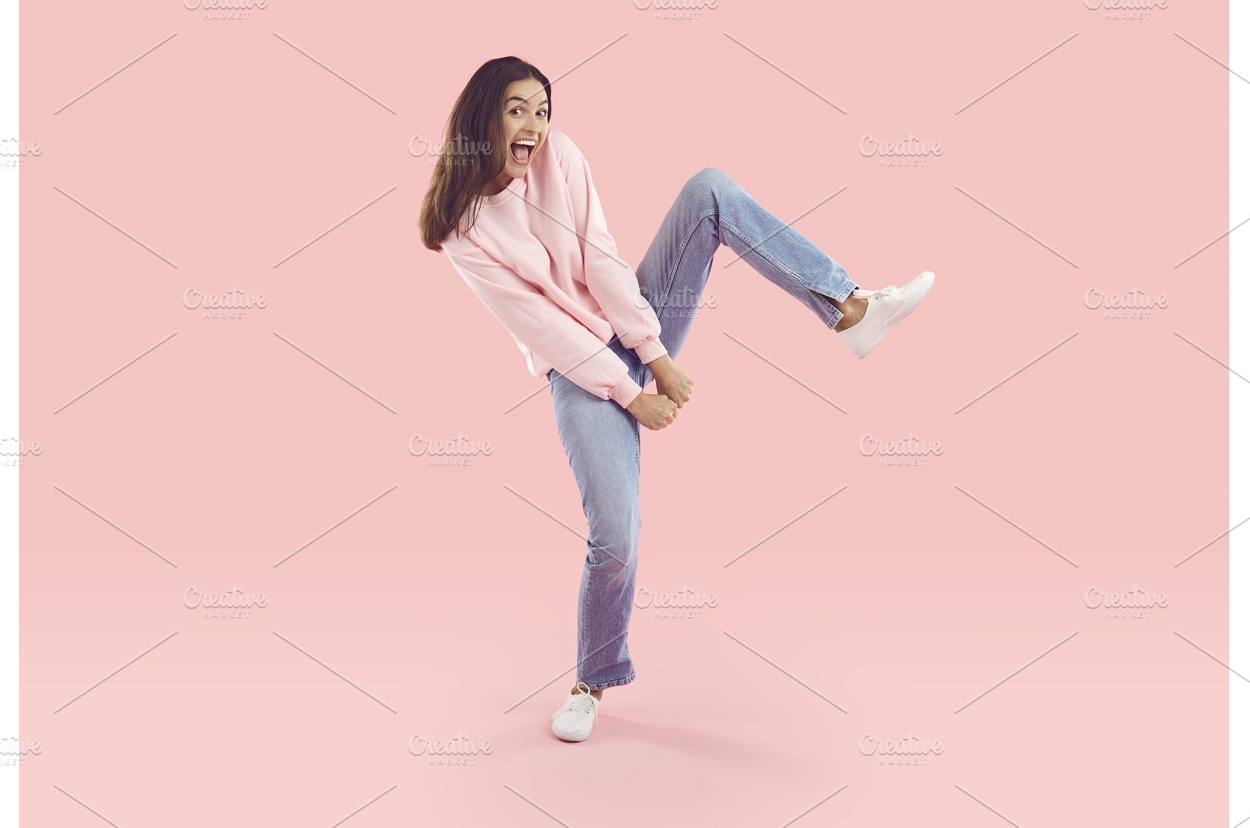 Cheerful young woman dancing, a Person Photo by StudioRomantic