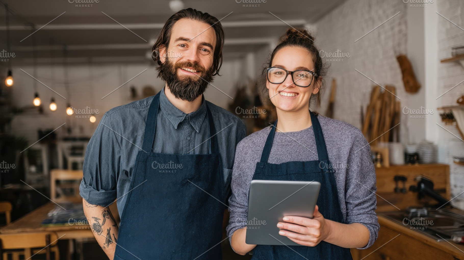 Couple teams up in cafe, a Photo by Beautiful things