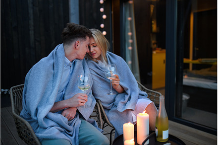 Young couple with wine resting, a Person Photo by HalfPoint