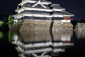Night view of Matsumoto Castle reflecting in the water, Japan, an Architecture Photo by GoodGoods