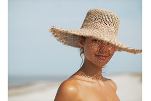 Beach Woman in Sun Hat on Vacation