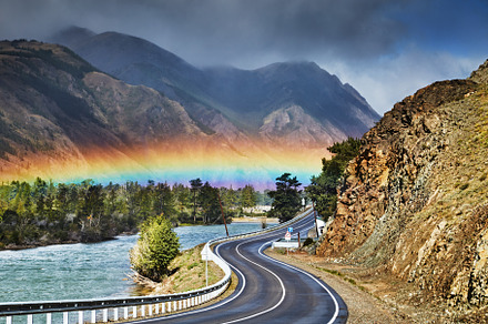 Mountain landscape, rainbow over roa