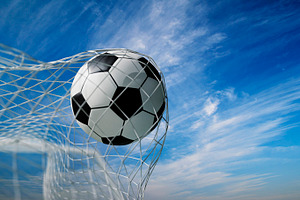 Soccer ball in goal net. Football, a Sports & Recreation Photo by hitdelight
