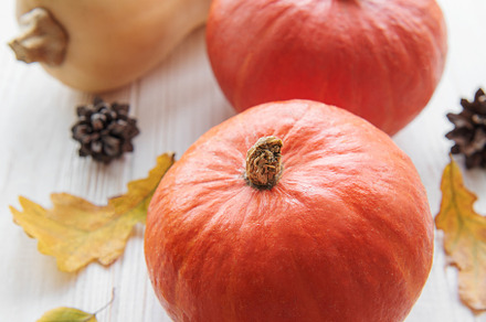 Autumn decorative pumpkins with fall leaves on wooden background, a Food & Drink Photo by Olena Rudo