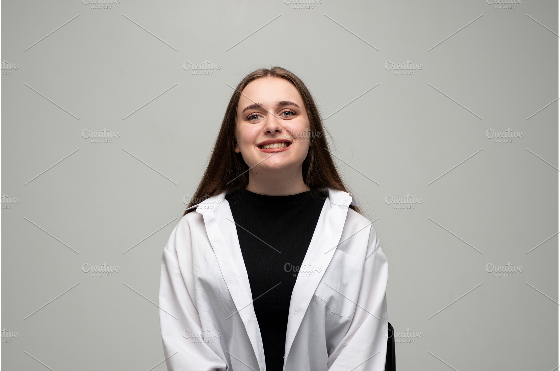 Young woman smiling broadly, a Person Photo by volodymyrshtun13795