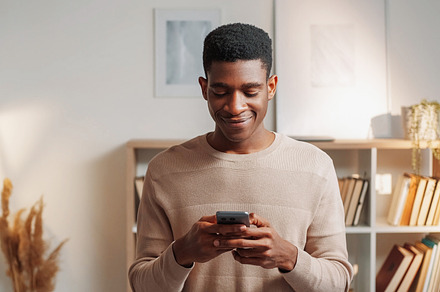 Mobile texting millennial generation cell man home, a Person Photo by Photo Drive Studio