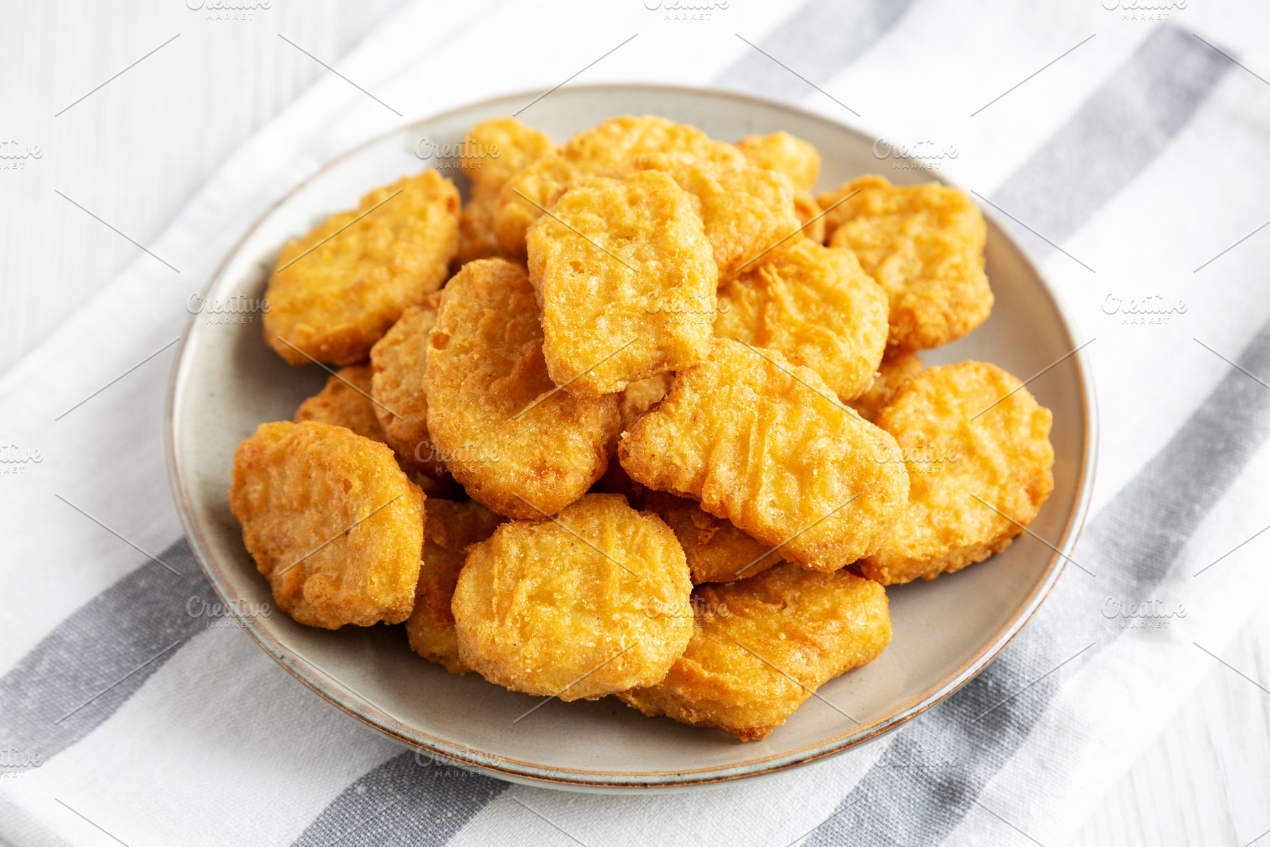 Homemade Chicken Nuggets with Ketchup, side view., a Food & Drink Photo by LiudmylaChuhunova