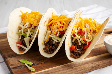 Homemade American Beef Tacos with lettuce, tomato and cheese on, a Food & Drink Photo by LiudmylaChuhunova