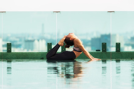 Attractive woman playing yoga featuring adult, asian, and attractive, a Health & Medical Photo by Guitarfoto Studio