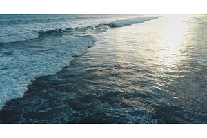 Ocean waves crashing on Bali beach, a Nature Photo by Goinyk