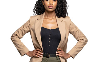 Black woman standing in front of a neutral backdrop wearing a bo, a Person Photo by DanFLCreativo