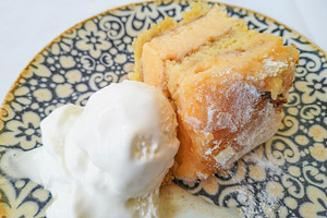 Sponge cake with vanilla ice cream on ceramic plate, a Food & Drink Photo by DanFLCreativo