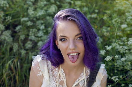 portrait of a teenage girl with purple hair and an earring in her nose sit in t, a Person Photo by SaulichPhoto