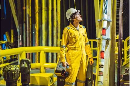 Young man in a yellow work uniform, a Person Photo by Elizaveta Galitskaya
