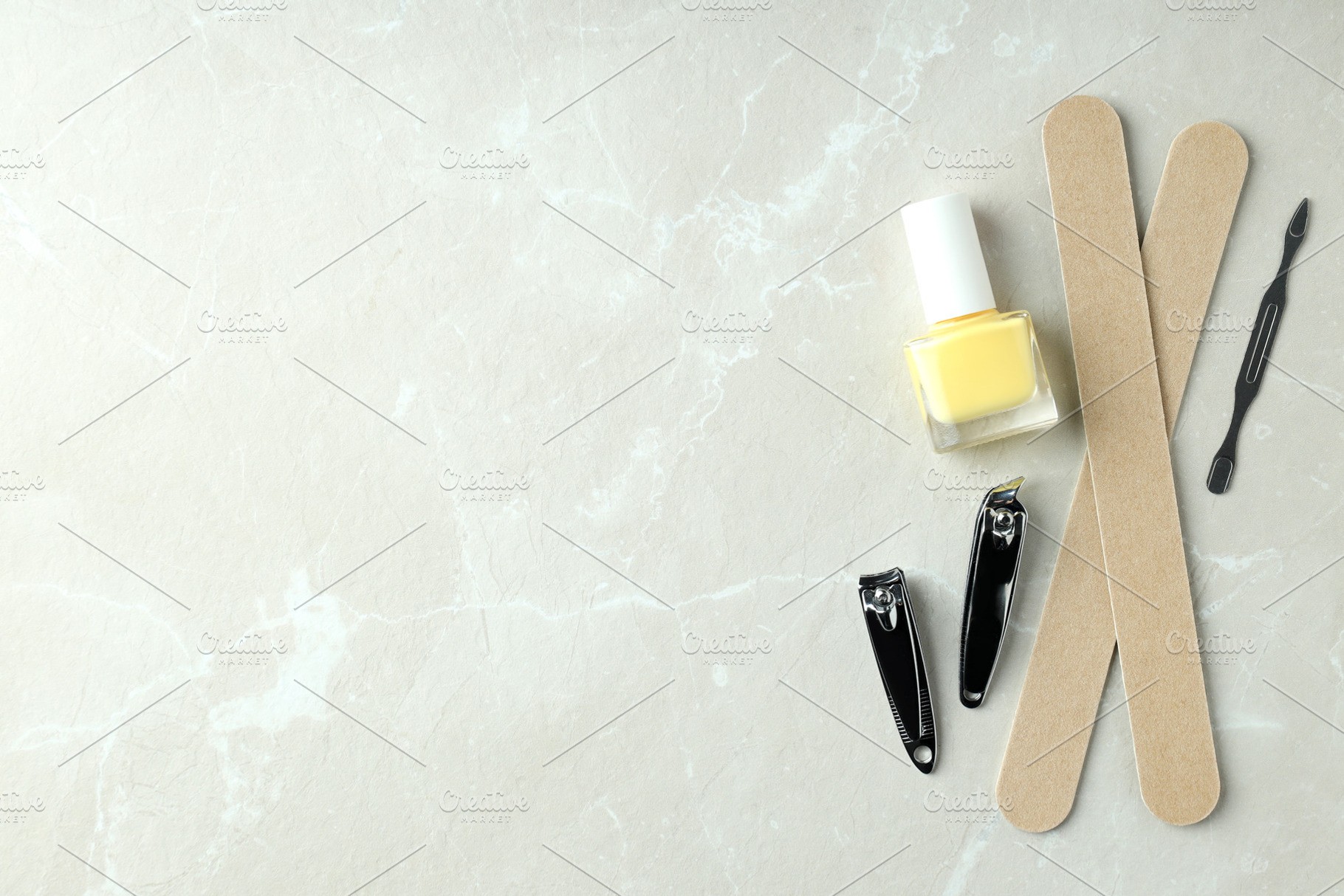 Concept of nail care with manicure accessories on light textured, a Beauty & Fashion Photo by AtlasStudio PRO