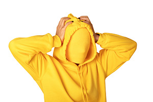 Anonymous person in a bright yellow hoodie with covered face, ha, a Person Photo by Ales Munt