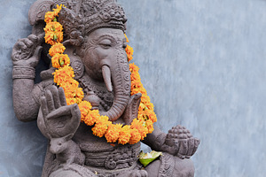Ganesha sitting in meditating pose featuring bali, ganesha, and yoga