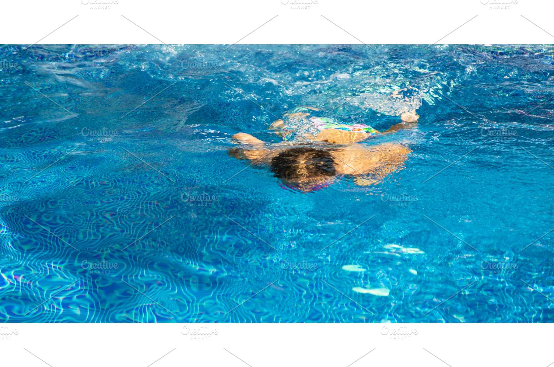 Child Dives in the pool. Selective, a Nature Photo by yanadjana