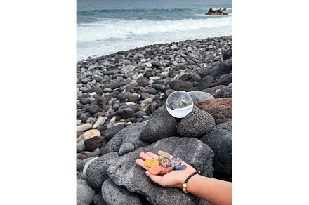 Hand holding chakra healing stones, a Nature Photo by tilialucida
