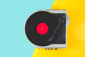 Vinyl record with red label and old featuring album, art, and background