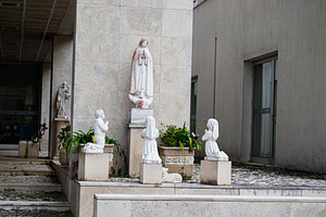 Religious statues depicting Fatima scene outside a holy building in Portugal, a Photo by AS photostudio