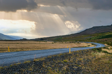 Asphalt road and sunset mountain view during auto trip in Icelan, a Nature Photo by YuriyB