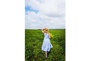 Beautiful girl in a hat with a, a Nature Photo by Artsaba Family
