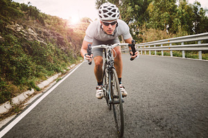 Cyclist pedaling on a racing bike featuring cyclist, cycling, and effort
