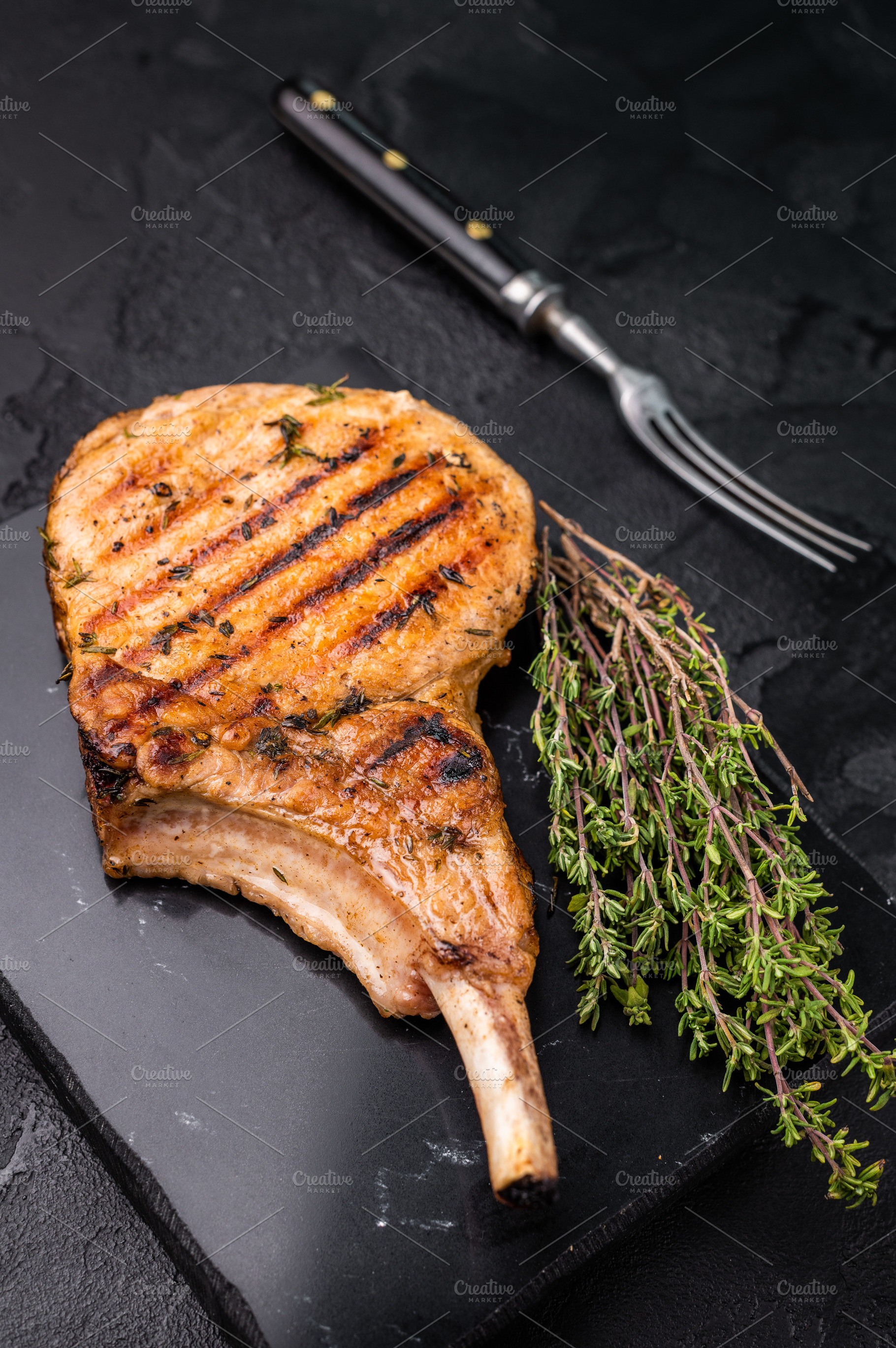 Savory bone in pork chop steak, beautifully charred and ready to, a Food & Drink Photo by composter-box@mail.ru