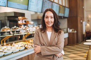 Young adult business woman in cafe