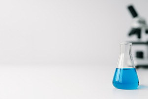 Laboratory glassware with blue liqui, a Photo by Dvoevnore photos
