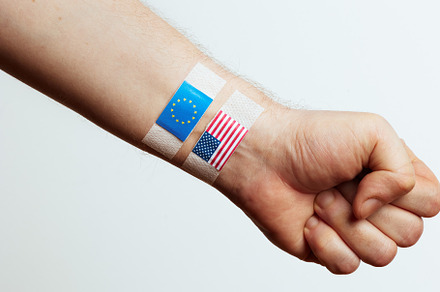 Fist with USA and EU Flags on Bandages, a Business Photo by Alliance Images